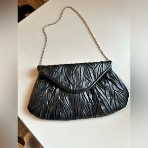 Jessica Mc Clintock black evening clutch  with silver chain.